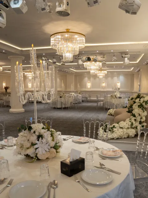 The Grand Ballroom set for a wedding with chandeliers and florals